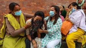 Border floods kill 1,280 as China sends DNA experts and Nepal brings citizens home